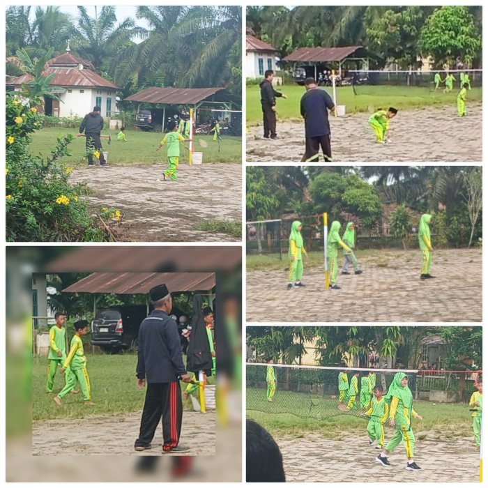 Guru PJOK MIN 2 Muaro Jambi Bimbing Siswa Berolahraga Di Lapangan Terbuka