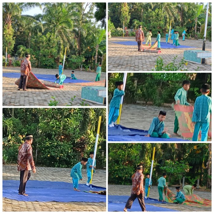 Ahmad Zamroni Staf MIN 2 Muaro Jambi Dampingi Siswa Pasang Tikar untuk Yasinan