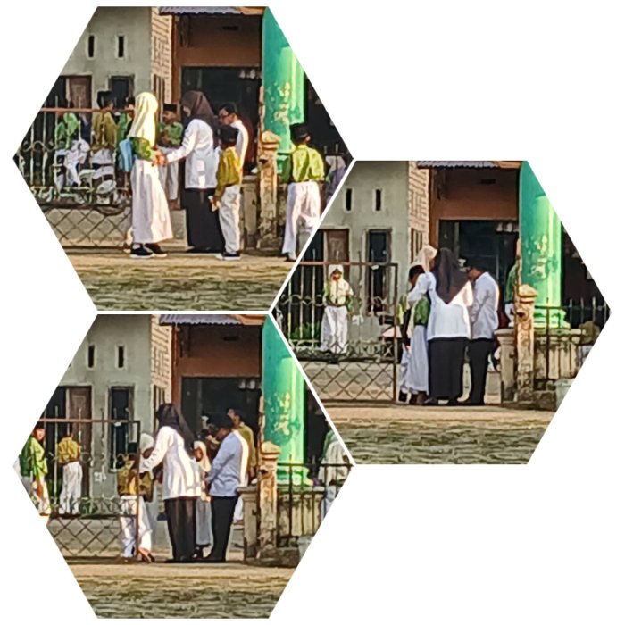 Guru  Piket Madrasah  MIN 2 Muaro Jambi Sambut Siswa di Gerbang Sekolah