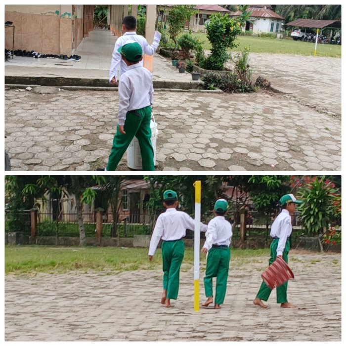 Musyaropah Bimbing Siswa Buang Sampah Pada Tempatnya Musyaropah Bimbing Siswa Buang Sampah Pada Tempatnya